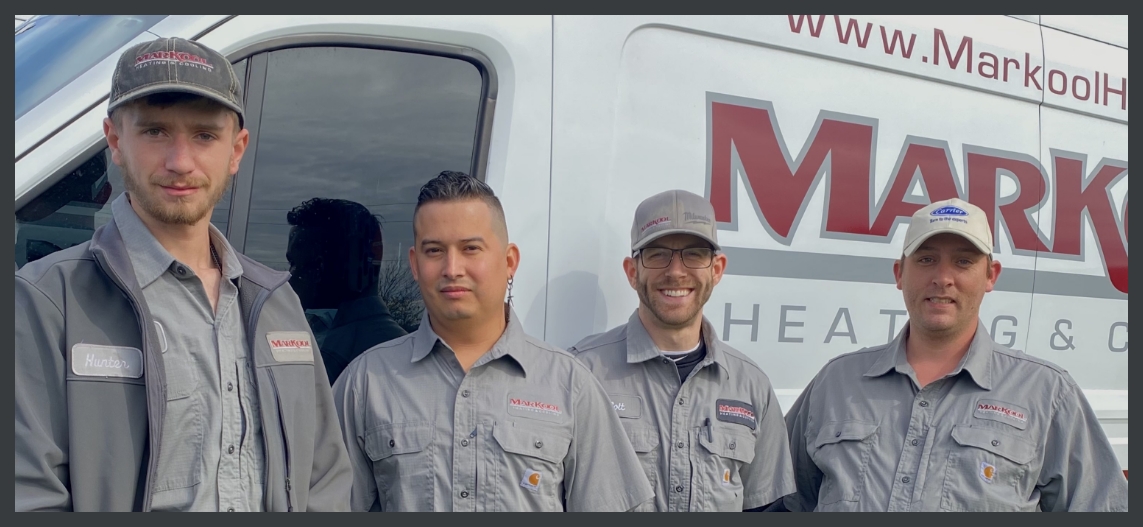 Markool Heating & Cooling employees standing in front of van